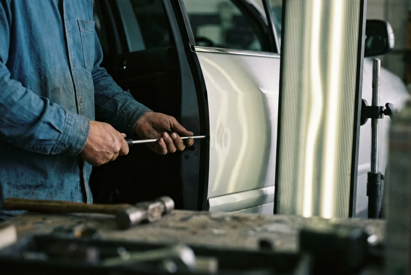 B&L technician repairing metal crease on door panel